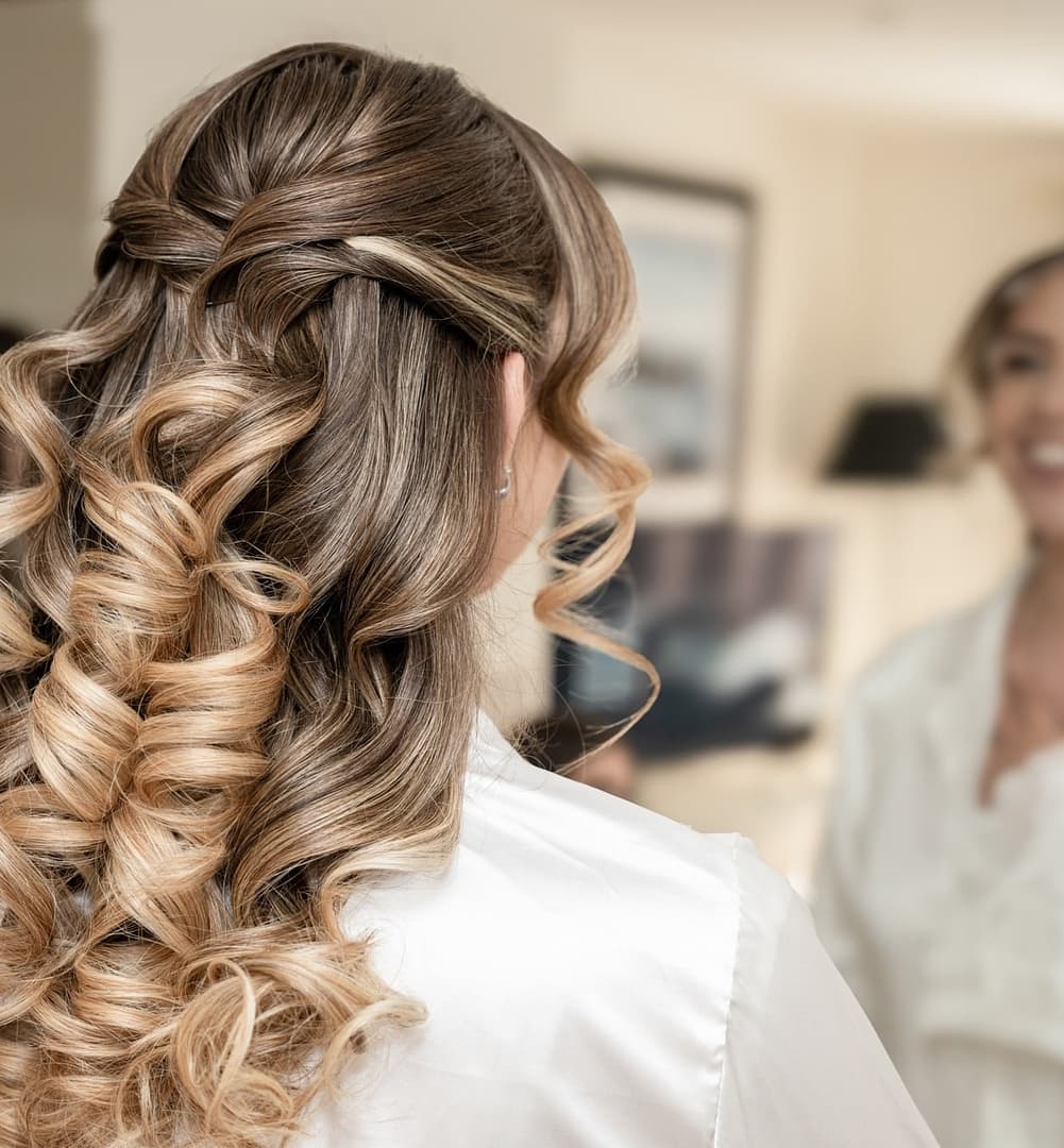 bride looking in mirror