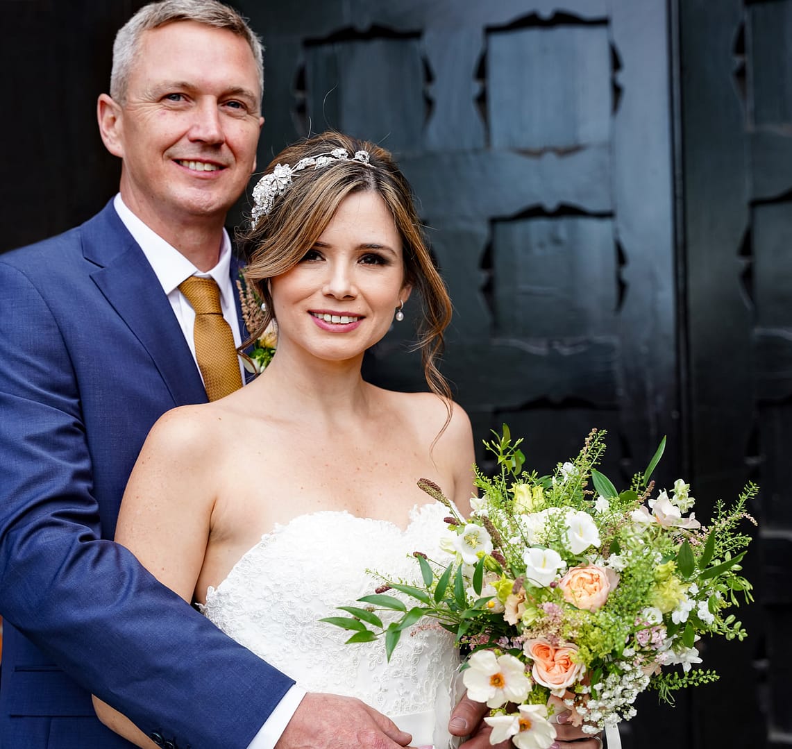 bride and groom at the door of st albans registry office