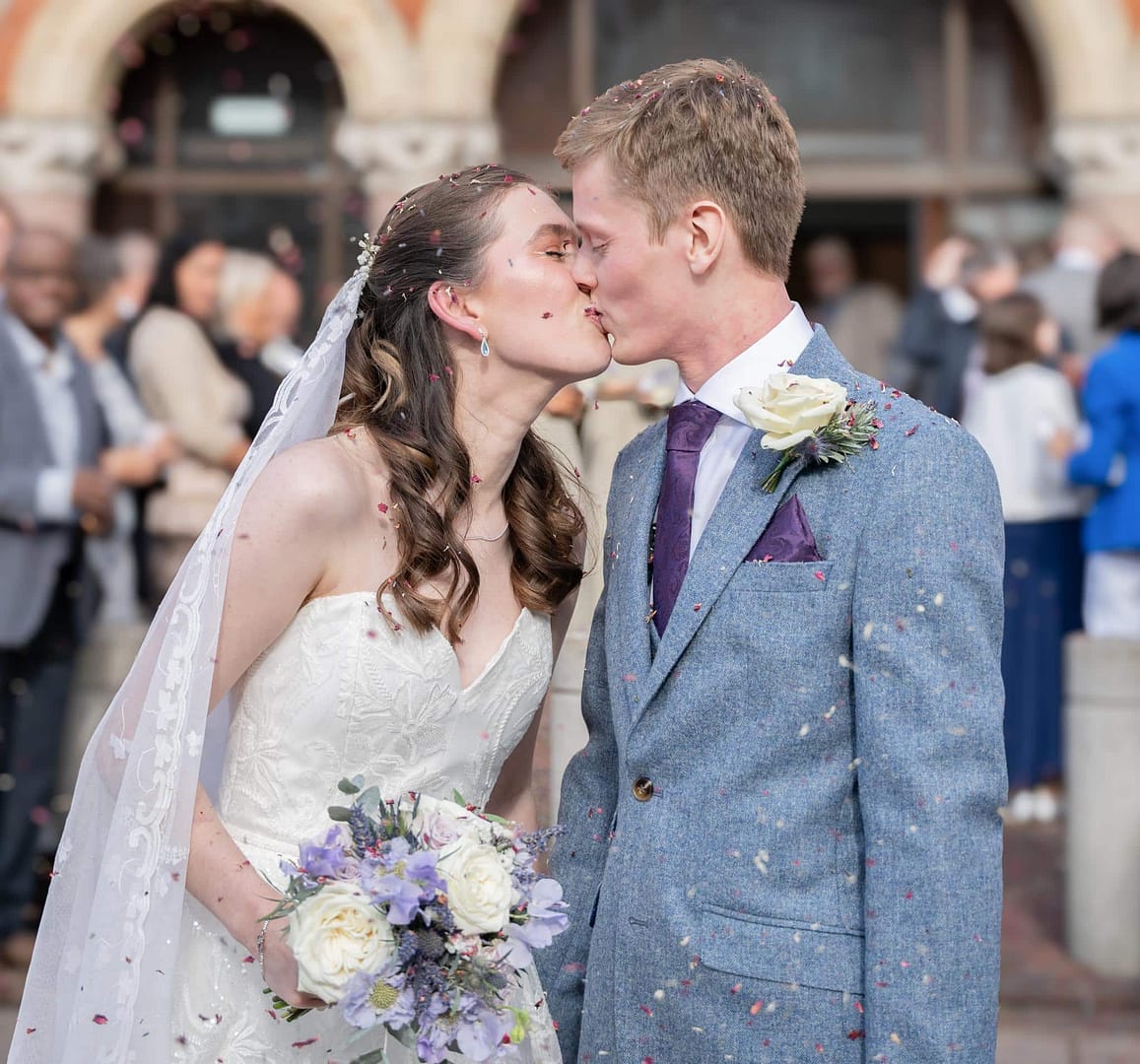 bride and groom kissing on wedding day