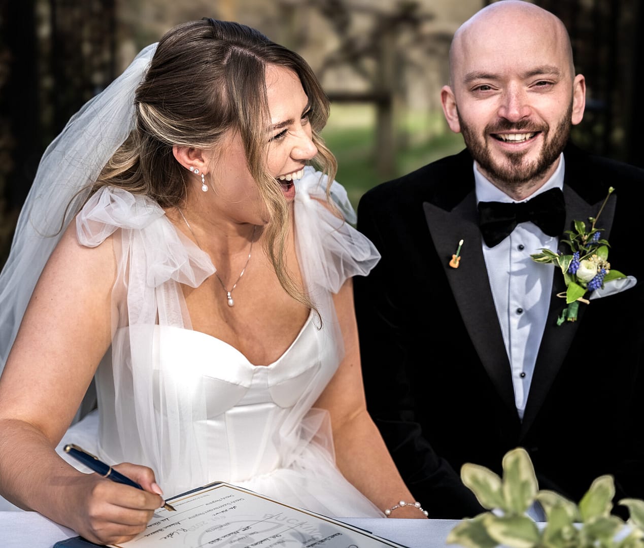 bride and groom laughing