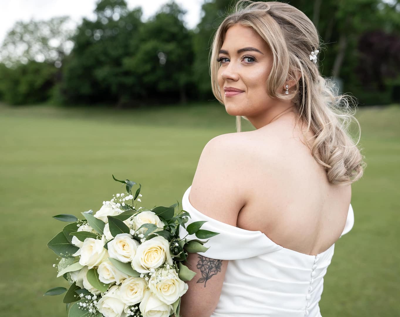 bride with white bouquet at the london shendley club