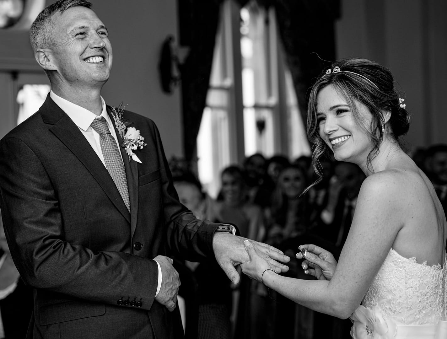 bride and groom laughing during wedding ceremony
