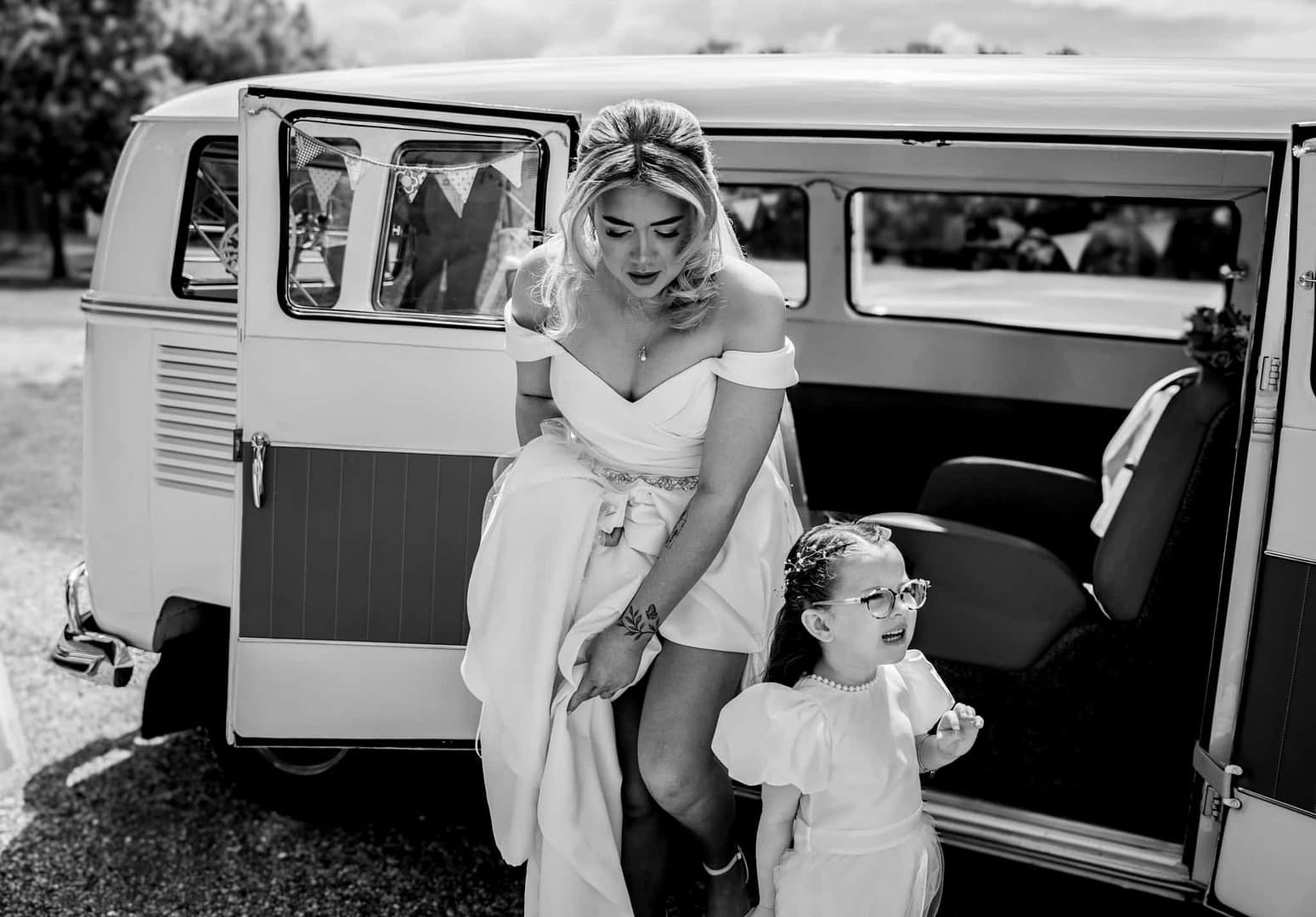 bride getting out of vw camper van at shenley cricket club