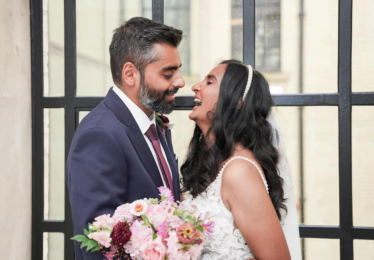 bride and groom laughing
