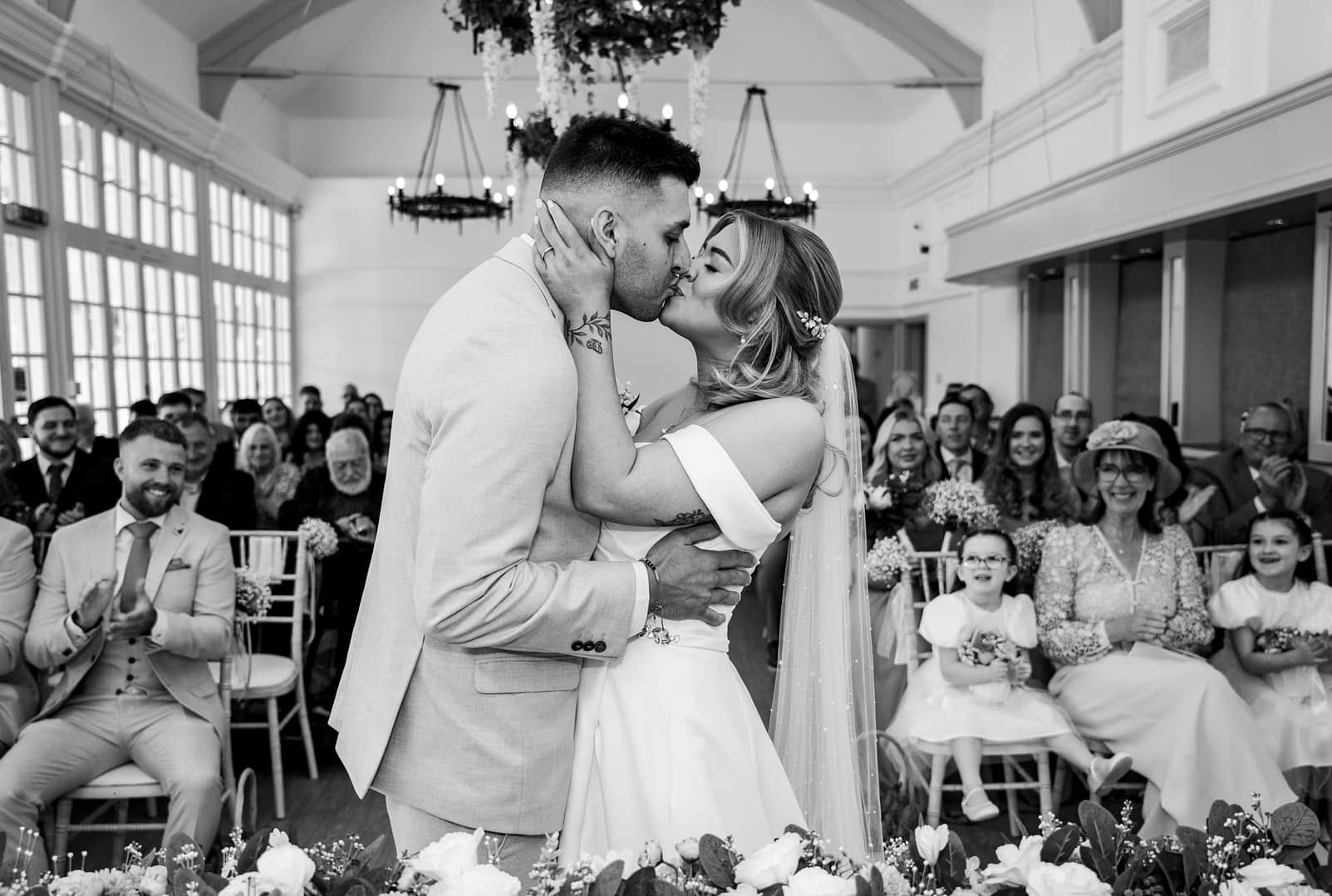 bride and groom kissing at the london shenley club