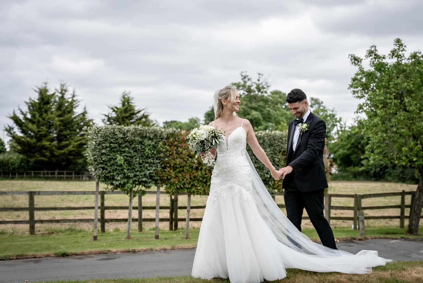 bride and groom holding hands
