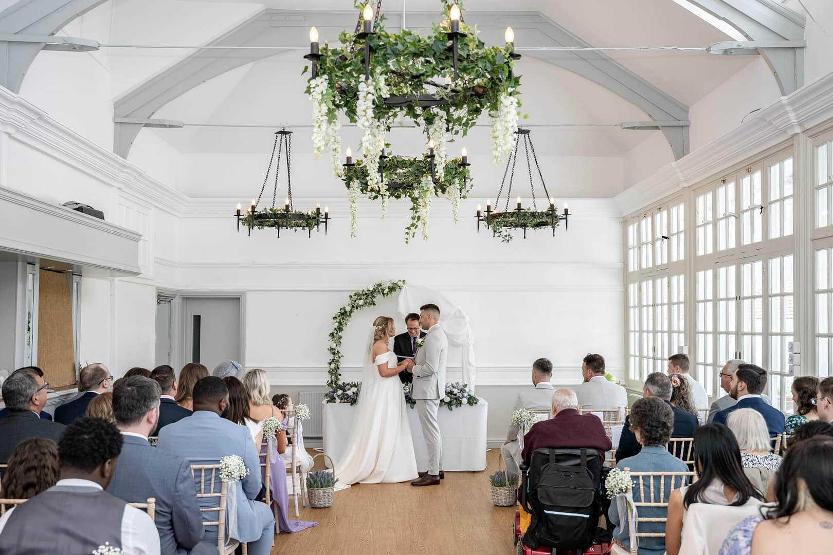 bride and groom exchanging rings at the london shenley club