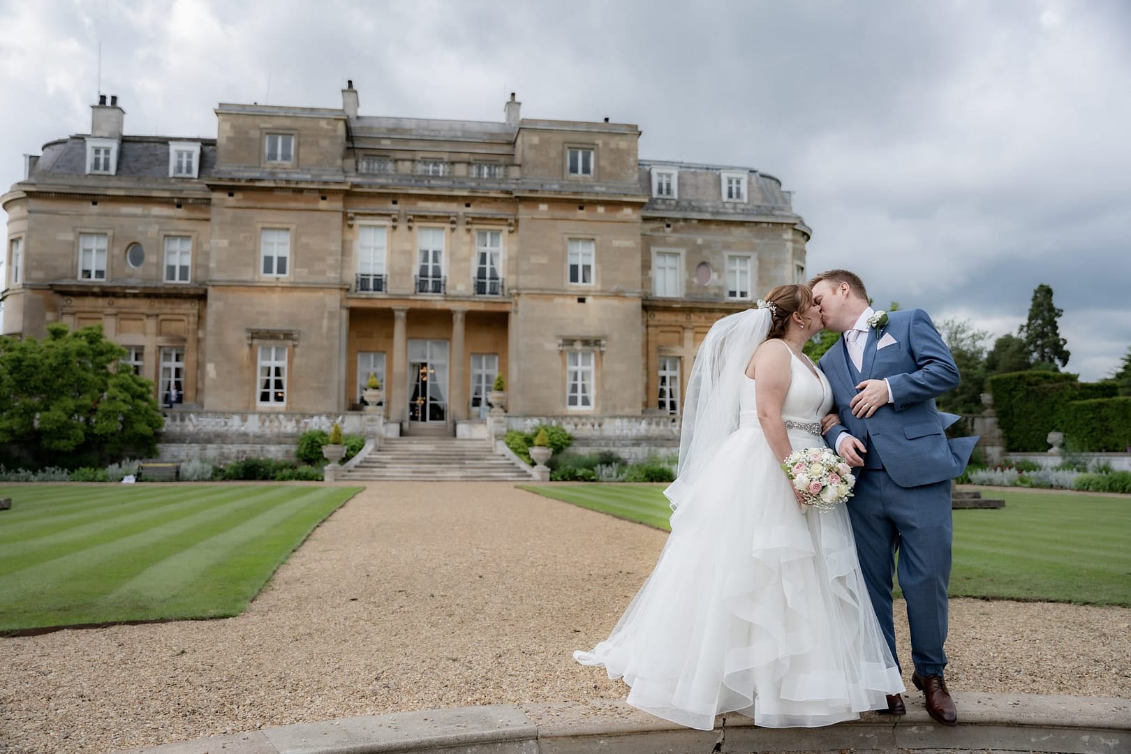 bride and groom kissing at luton hoo