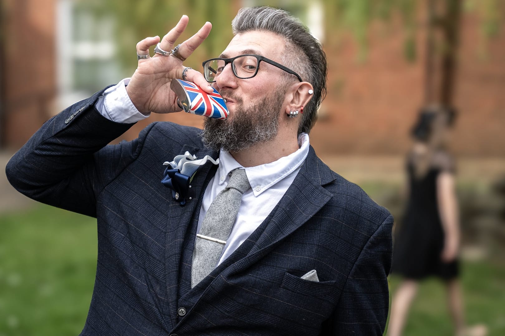 groom drinking from hip flask