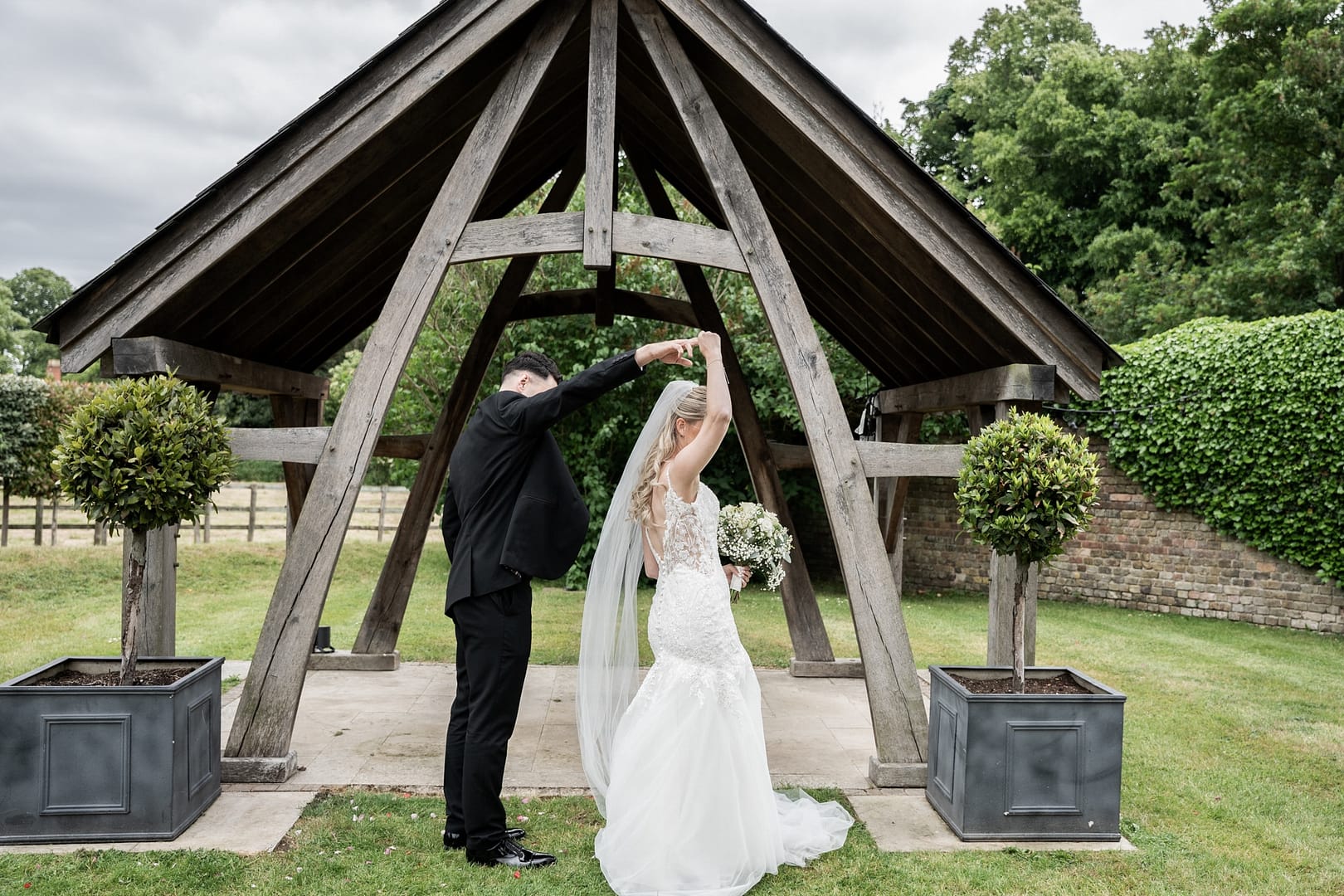 bride and groom dancing at tudor barn