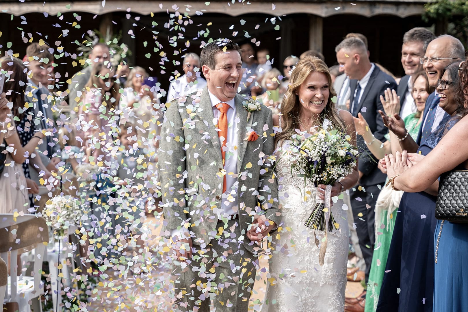confetti shower on bride and groom