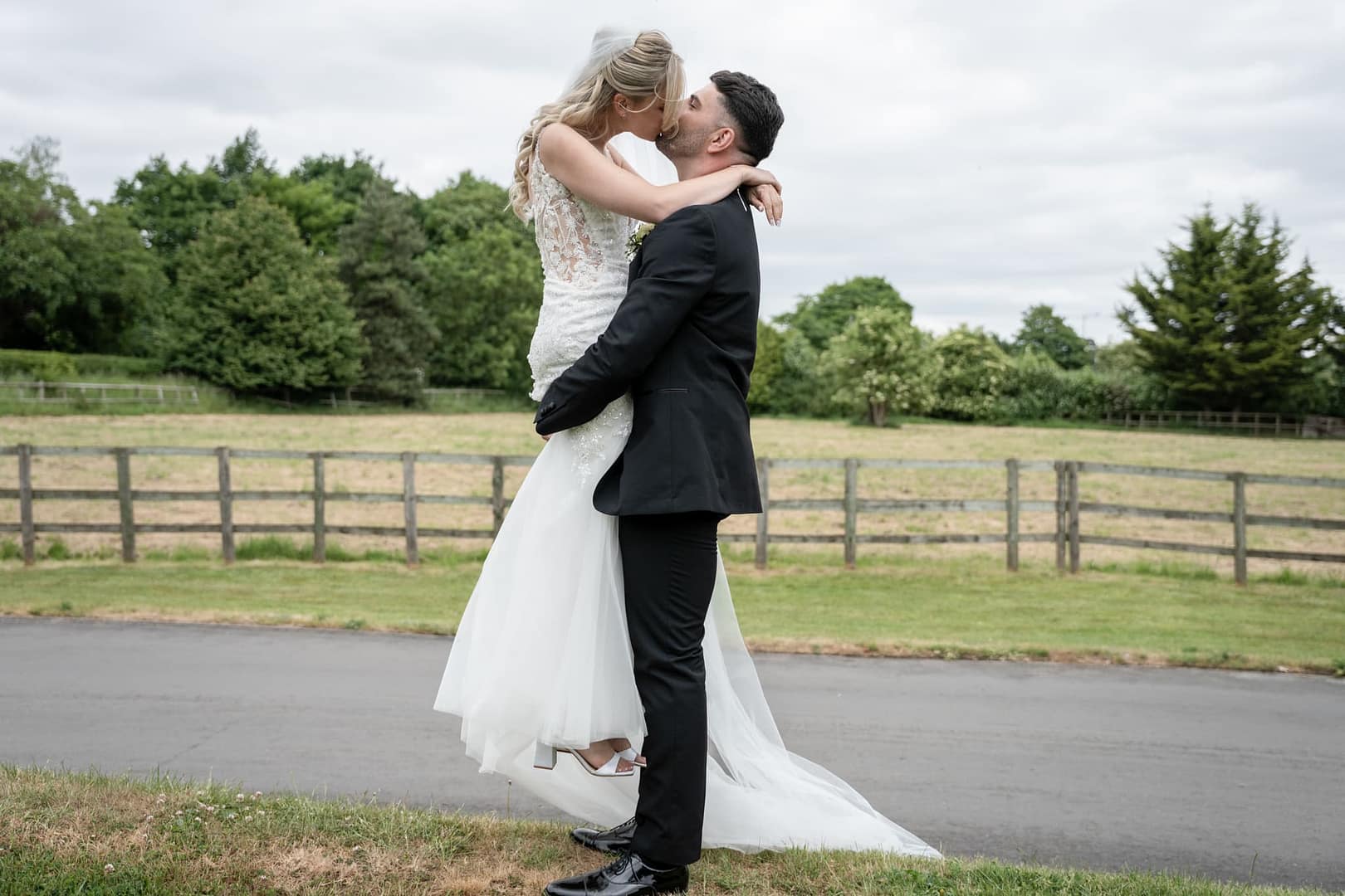 bride and groom kissing at tudor barn