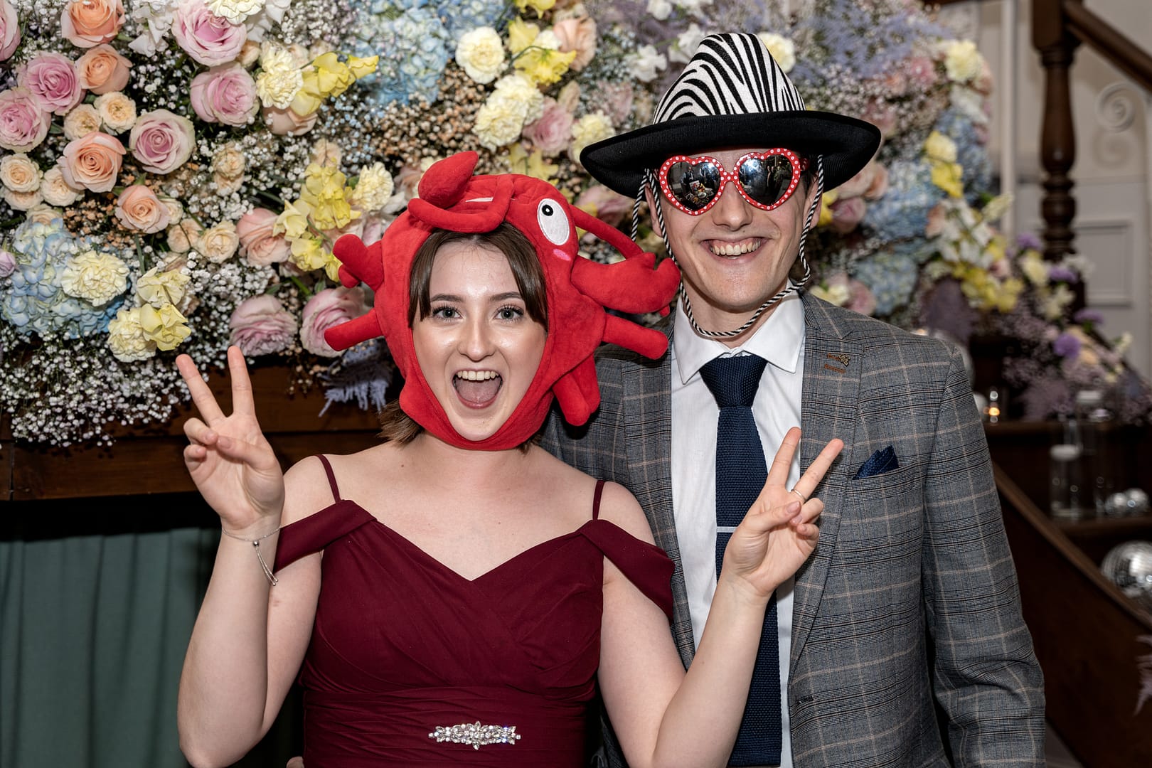 many and woman in funny hats at an event