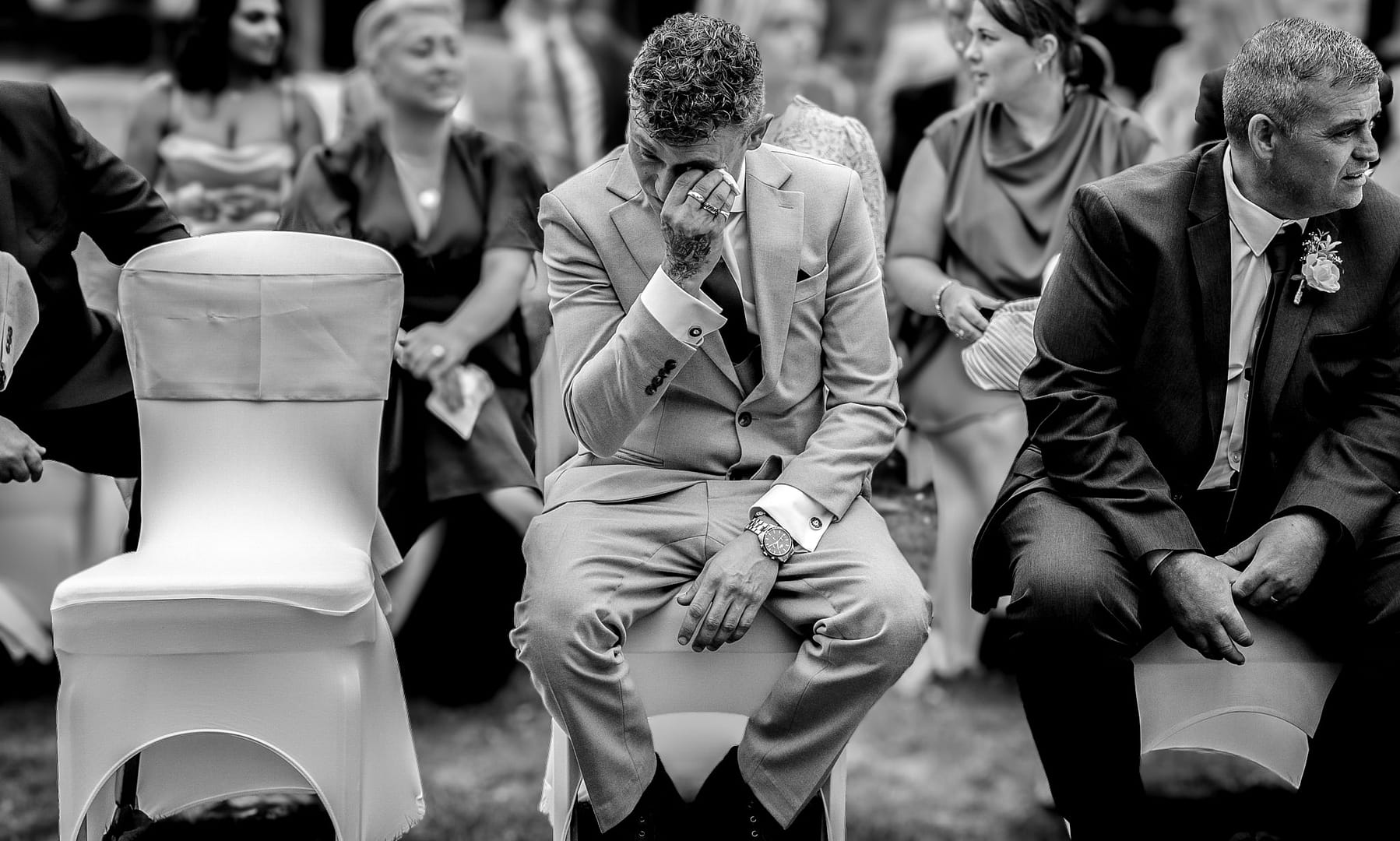 man crying at wedding