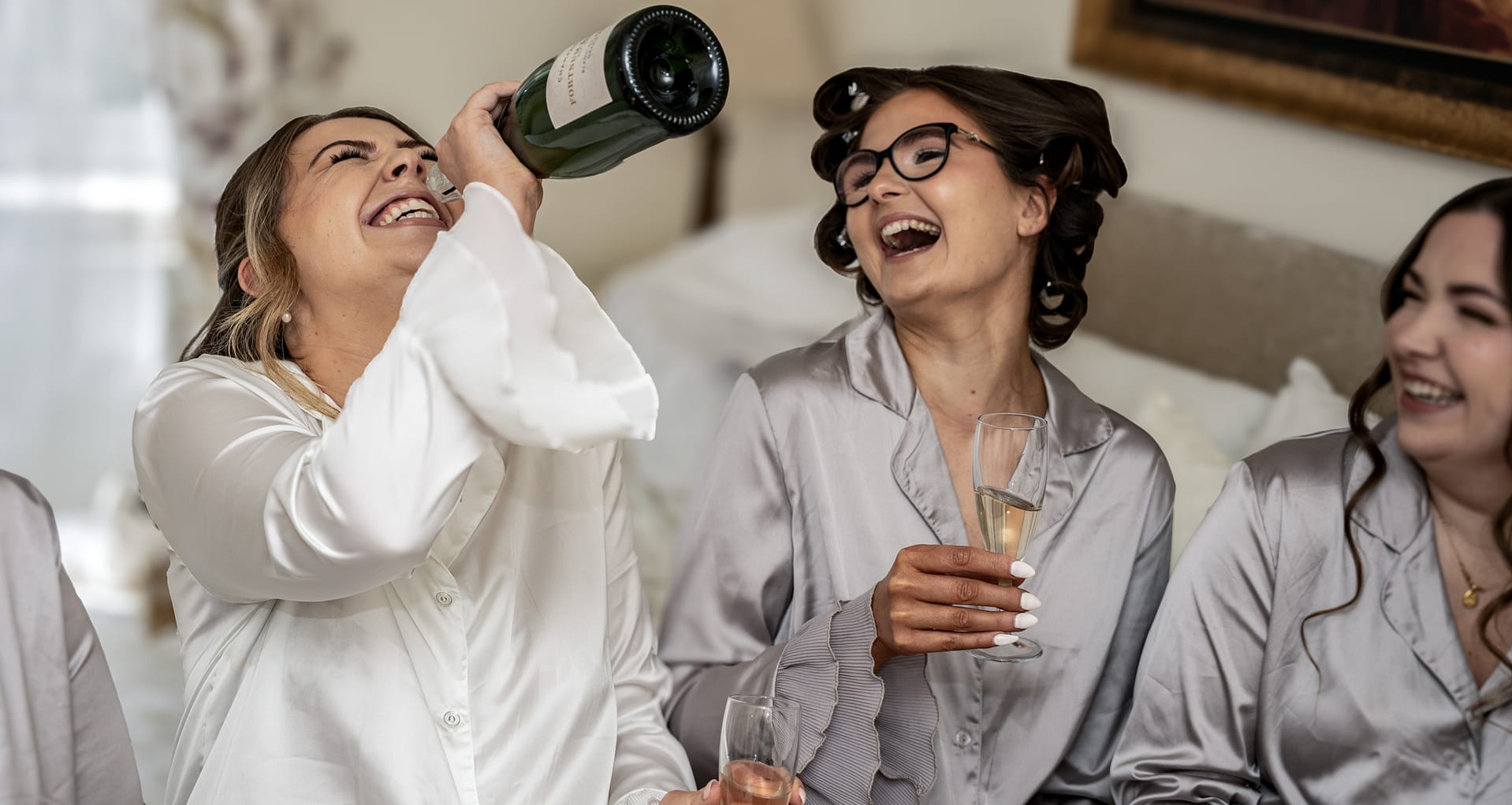 bride holidng champagne at weddings