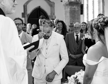 Candid laughter during wedding speeches at a Buckinghamshire manor house