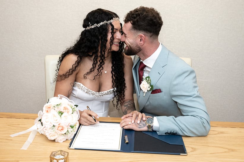 bride and groom smiling